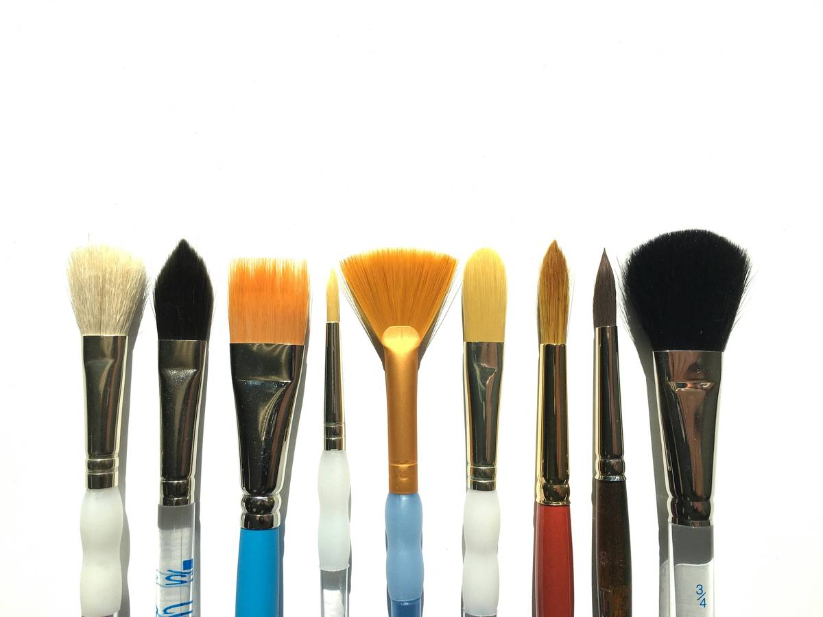 Comparison of affordable vs premium eyebrow comb set on clean vanity